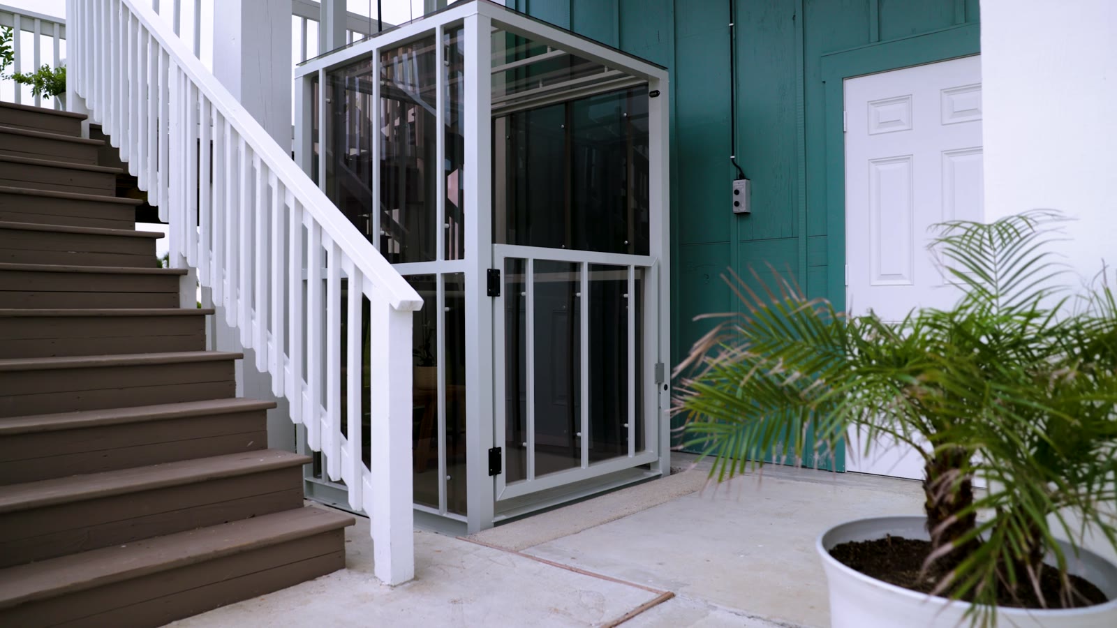 Traveler passenger lift beside the porch stairs at the home in Vincent Bruno’s video